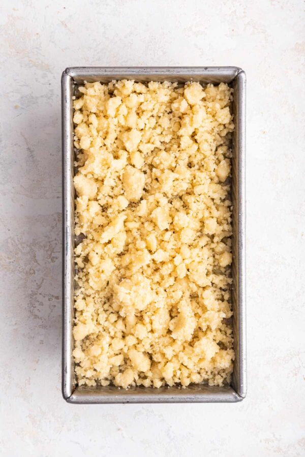 unbaked almond crumble topping covering a quick bread