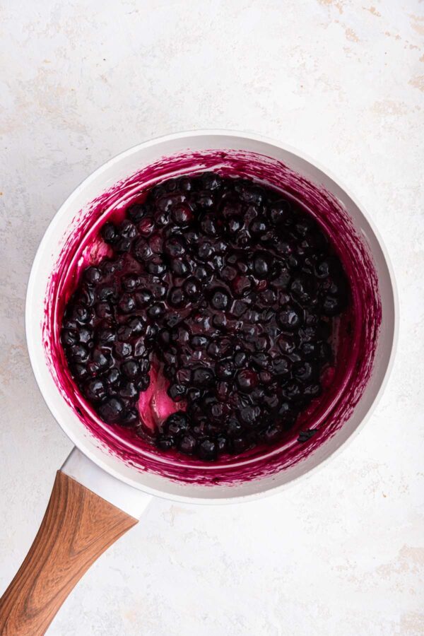 homemade blueberry pie filling cooked down on the stove