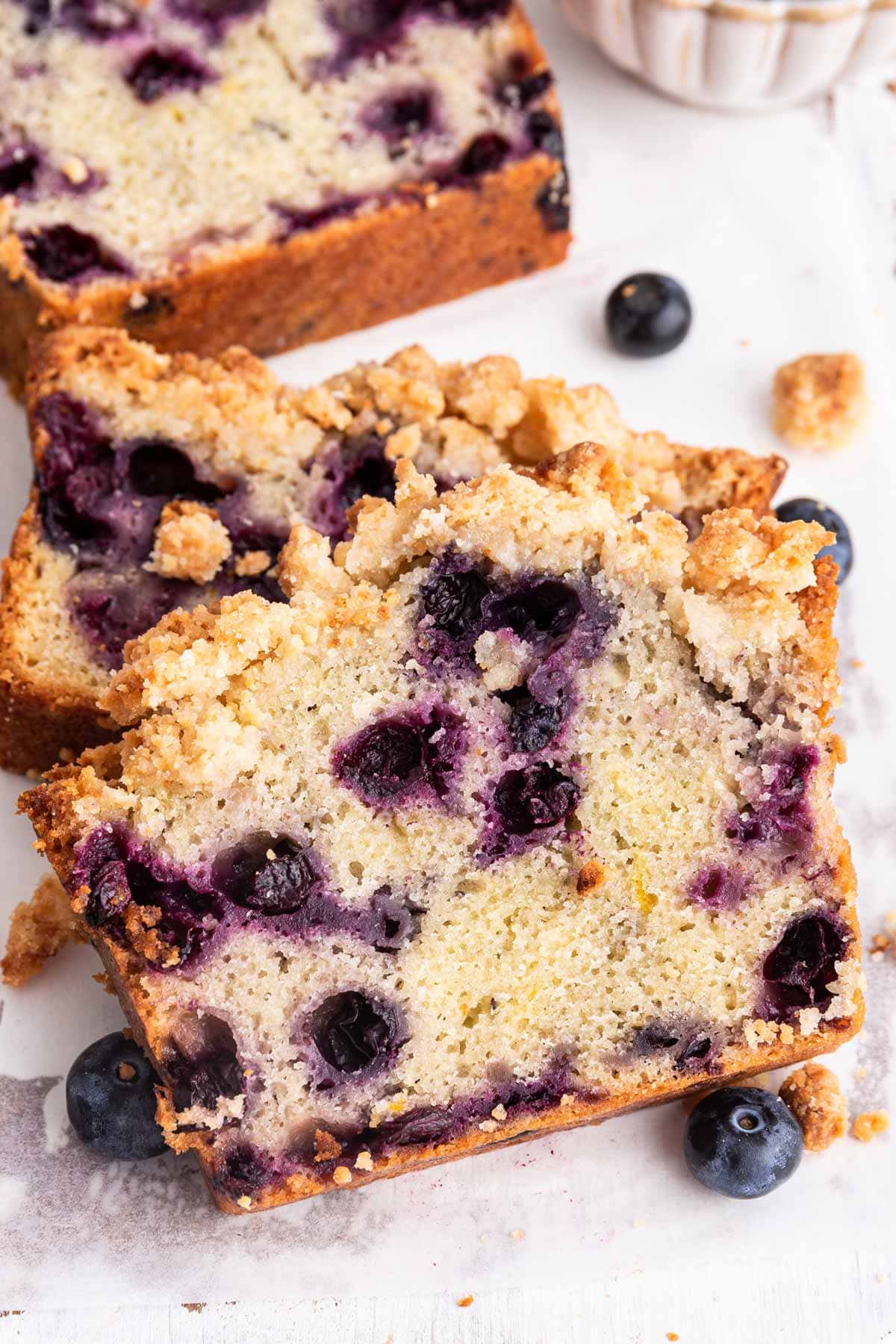 slice of quick bread filled with blueberries