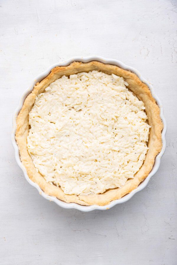 pie crust filled with a mixture of mayo and shredded cheese