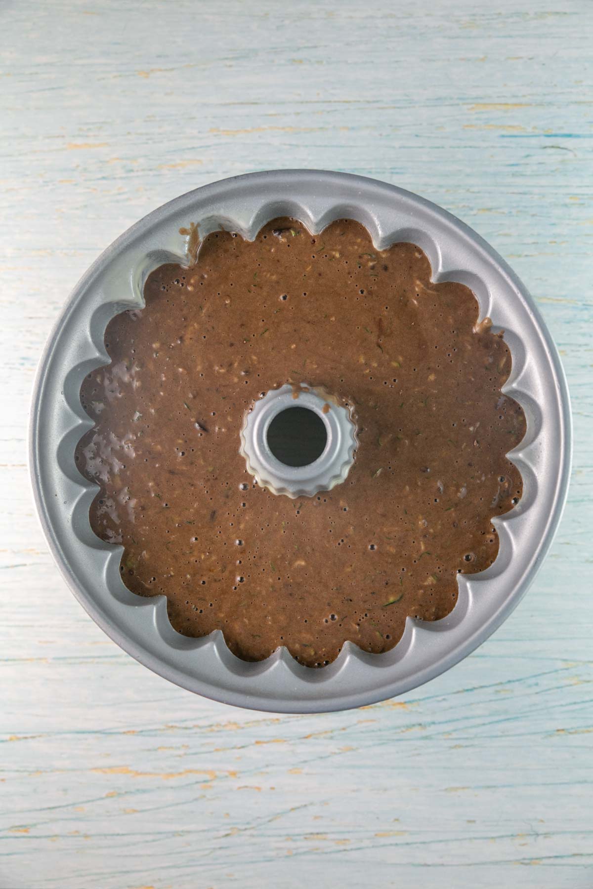 unbaked chocolate zucchini batter in a bundt pan