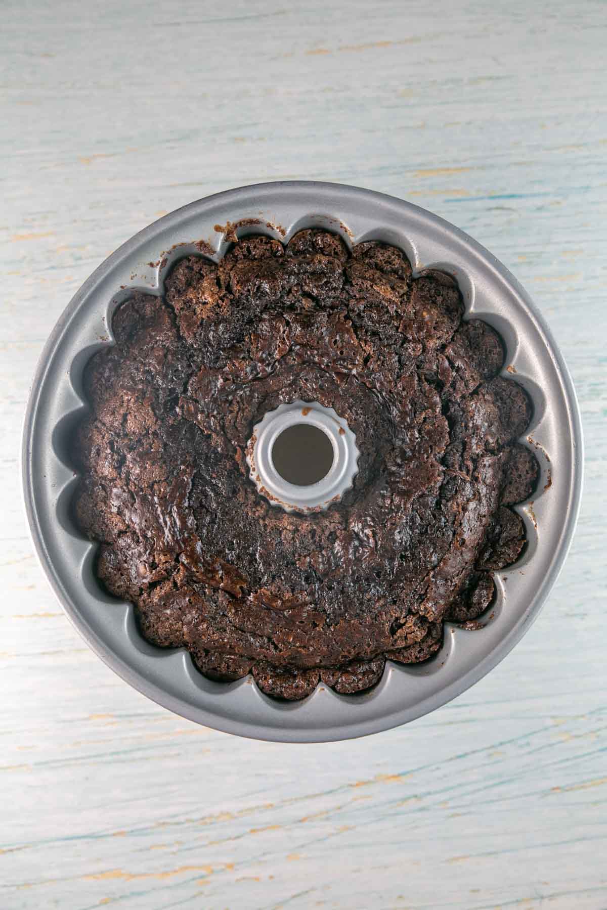 freshly baked chocolate zucchini cake in a decorative bundt pan