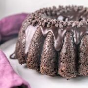 chocolate zucchini bundt cake covered with a thick fudgy chocolate glaze