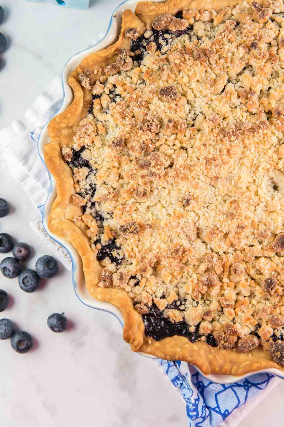 pie covered with a golden brown almond crumble topping