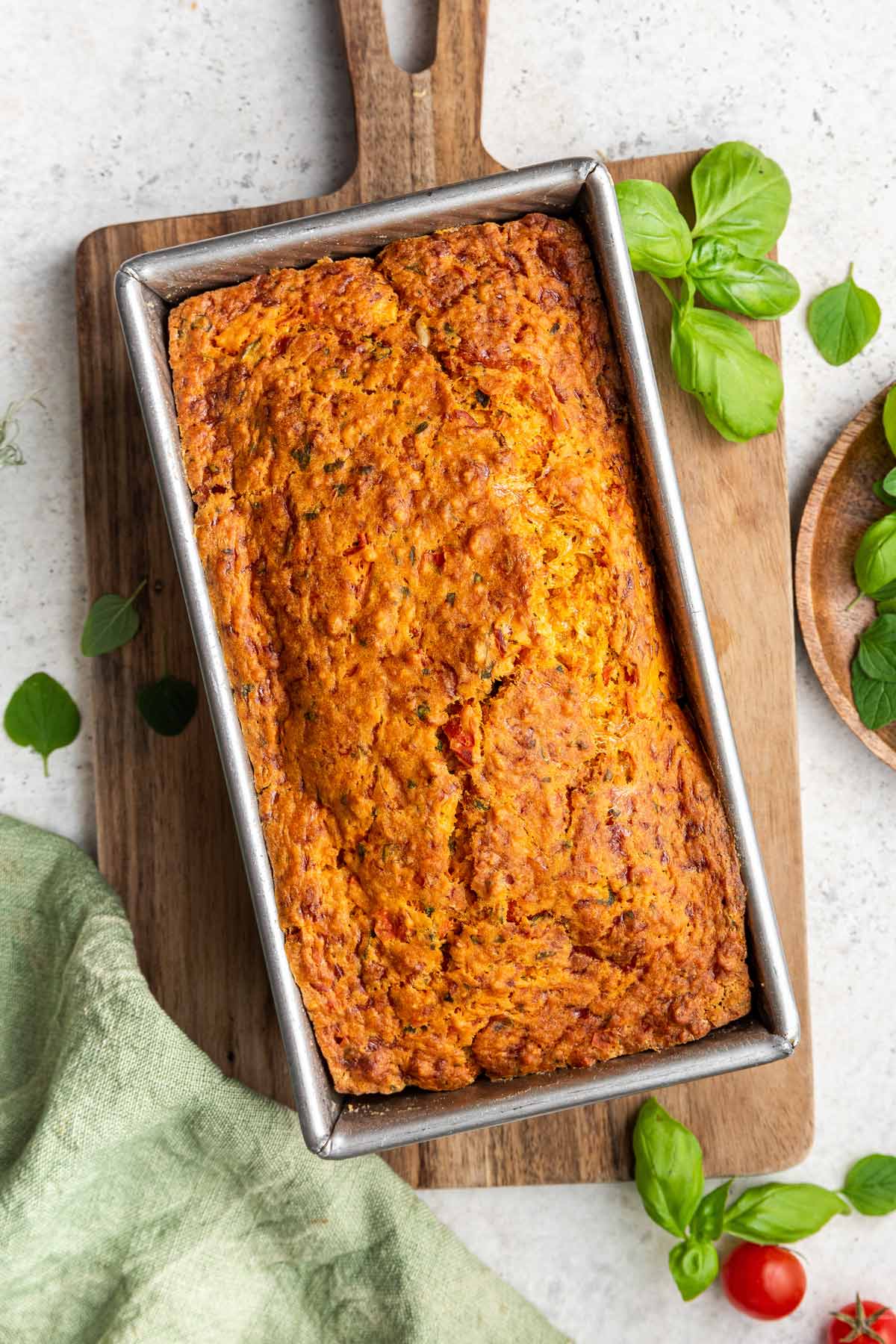 freshly baked quick bread made with ripe tomatoes and basil