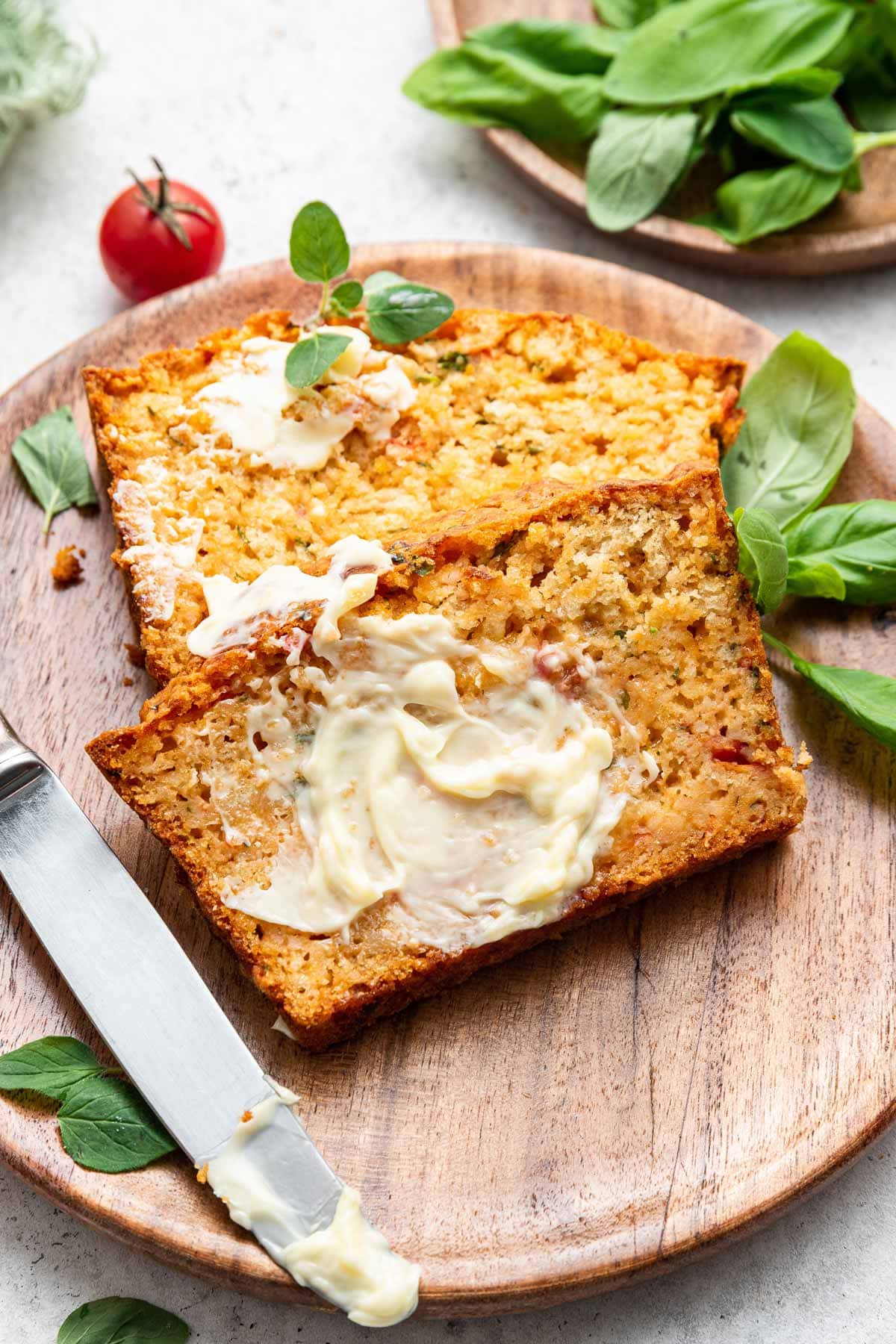 two slices of savory quick bread with butter spread on the slice