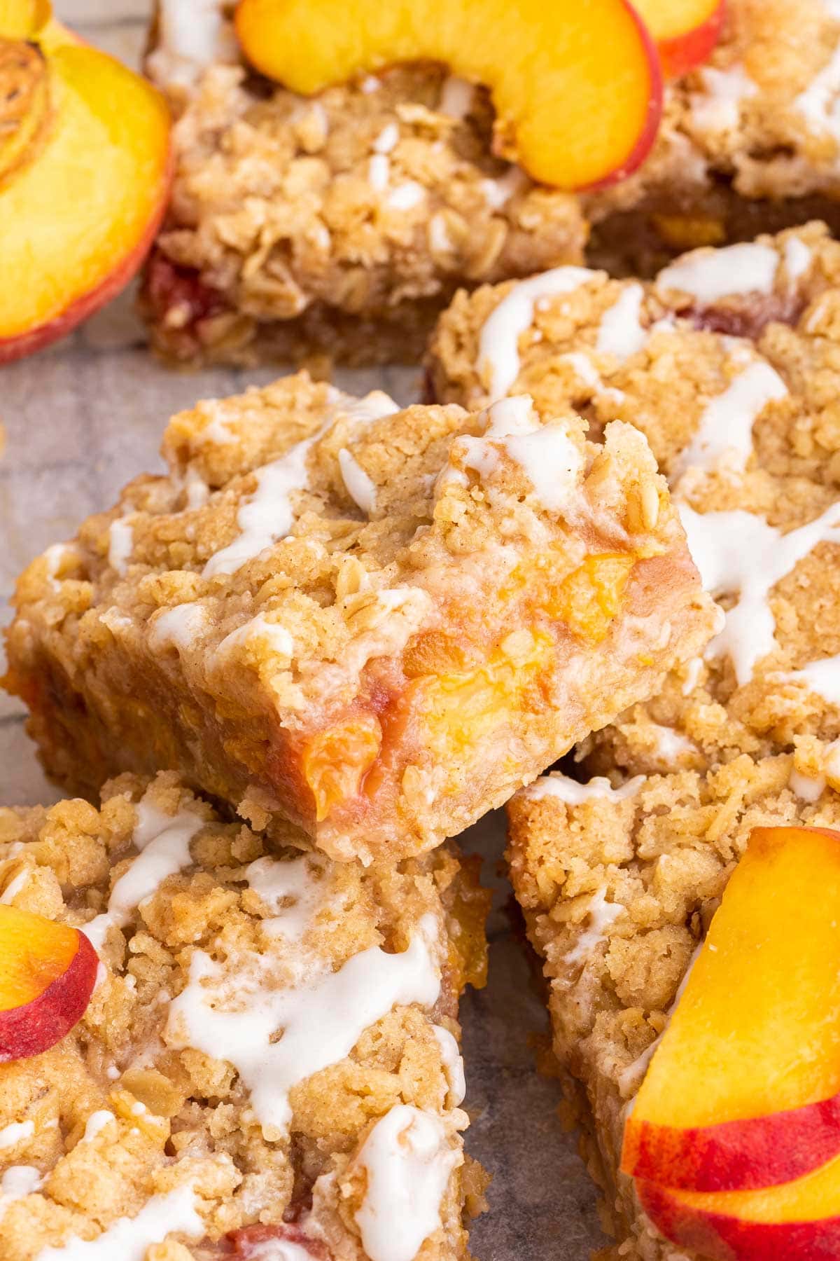 side view of peach pie bars showing the fresh peach filling inside