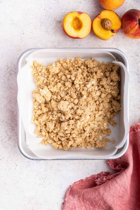 oatmeal crust in the bottom of a square baking pan