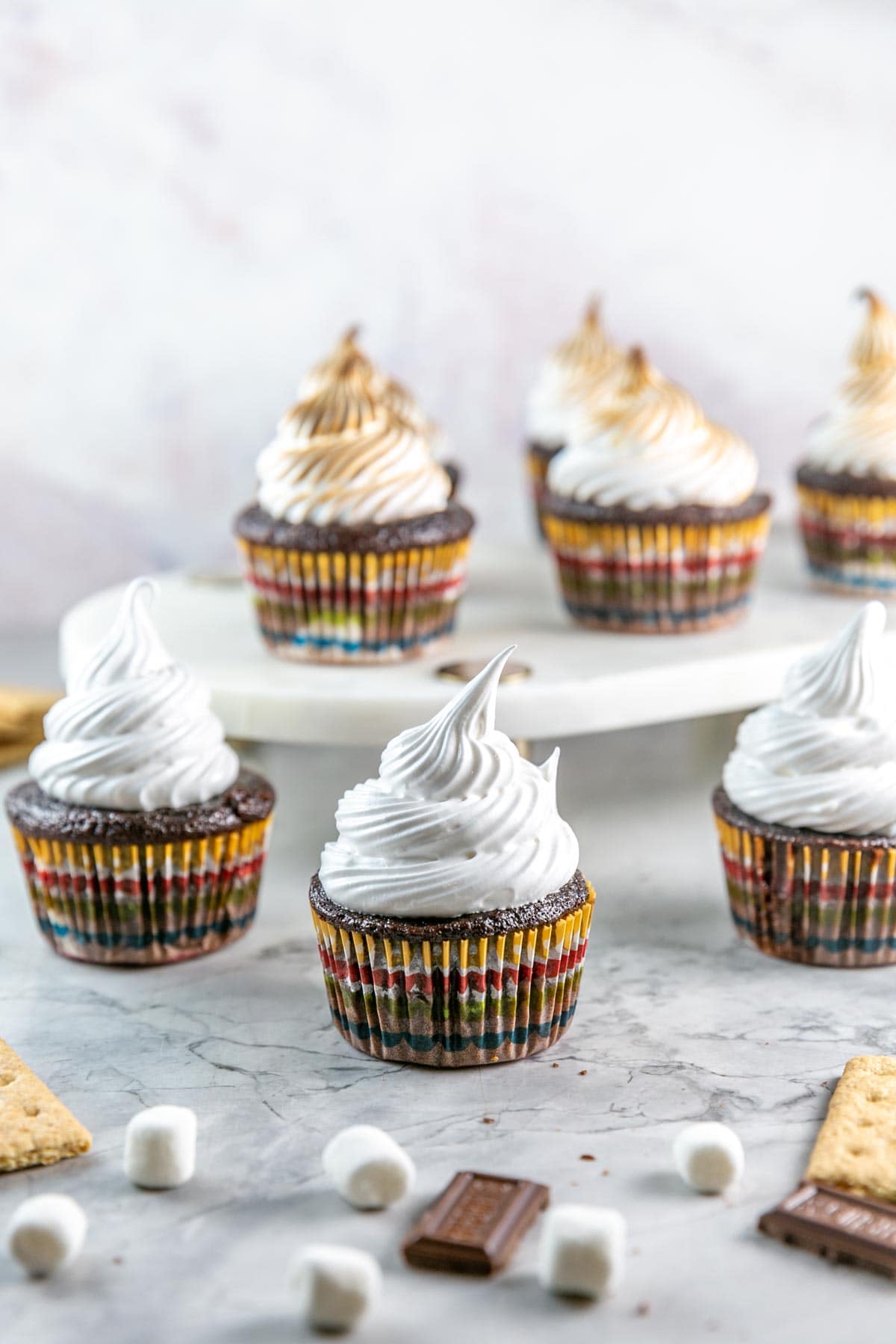 S'mores cupcakes with meringue topping before being toasted.