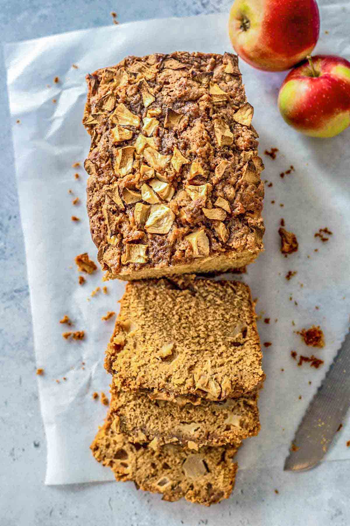 overhead view of a loaf of quick bread with a few slices cut.