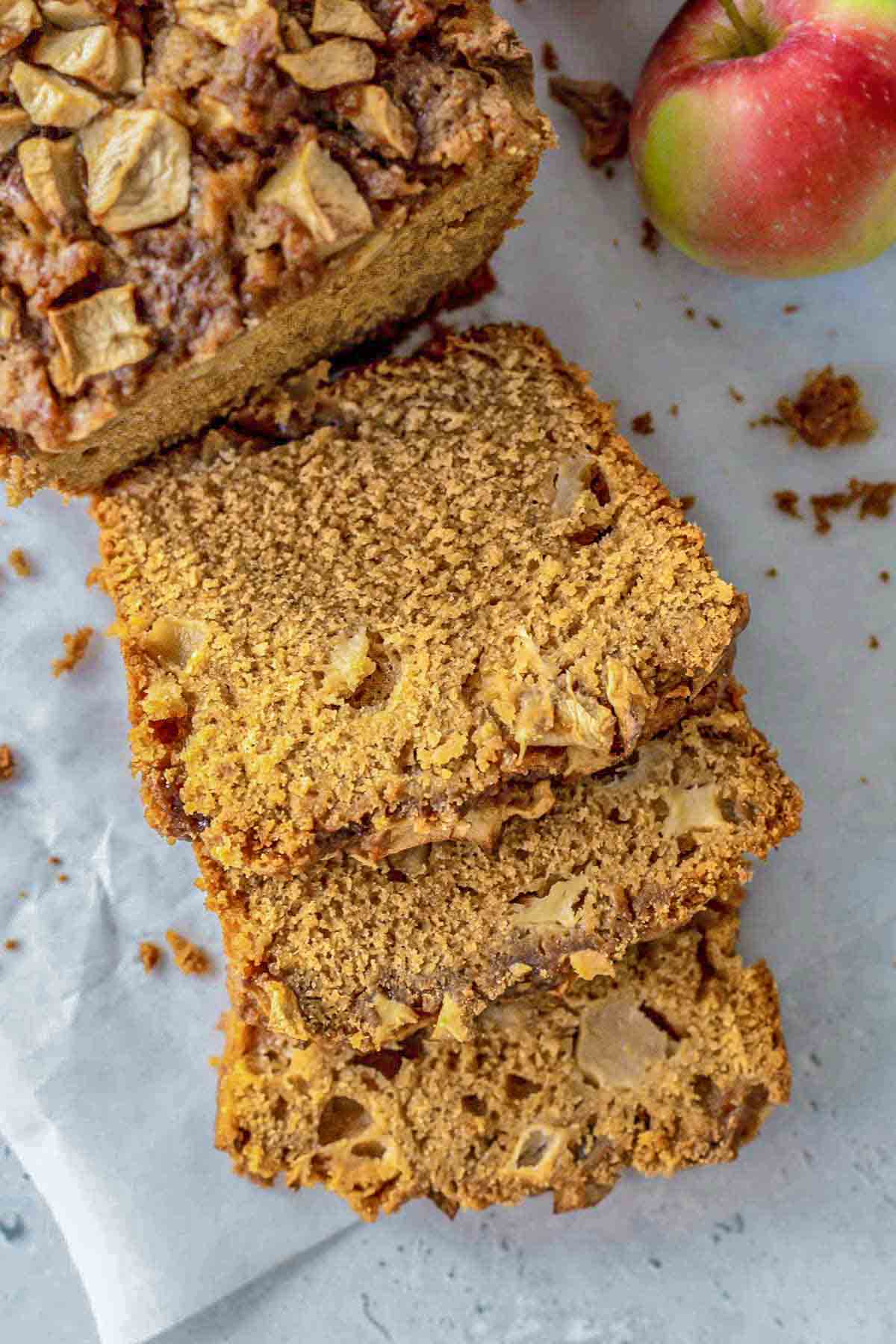 slices of apple bread with cinnamon crumble bits scattered in the background.