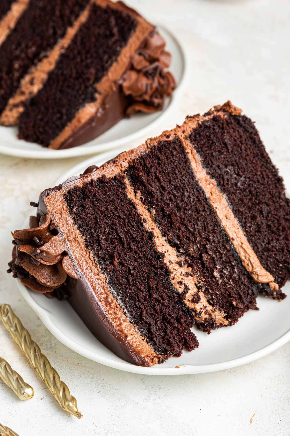 three layer slice of cake on its side highlighting the fine crumb texture