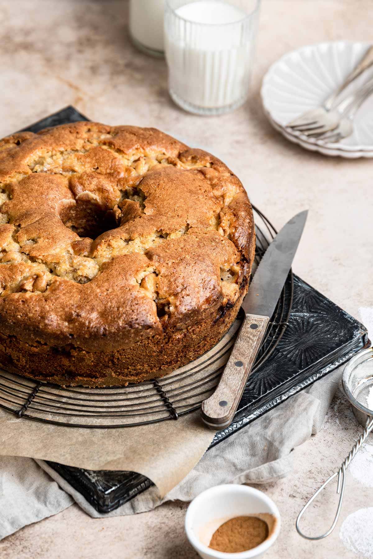 side view of an uncut Jewish apple cake showing the thickness of the baked cake