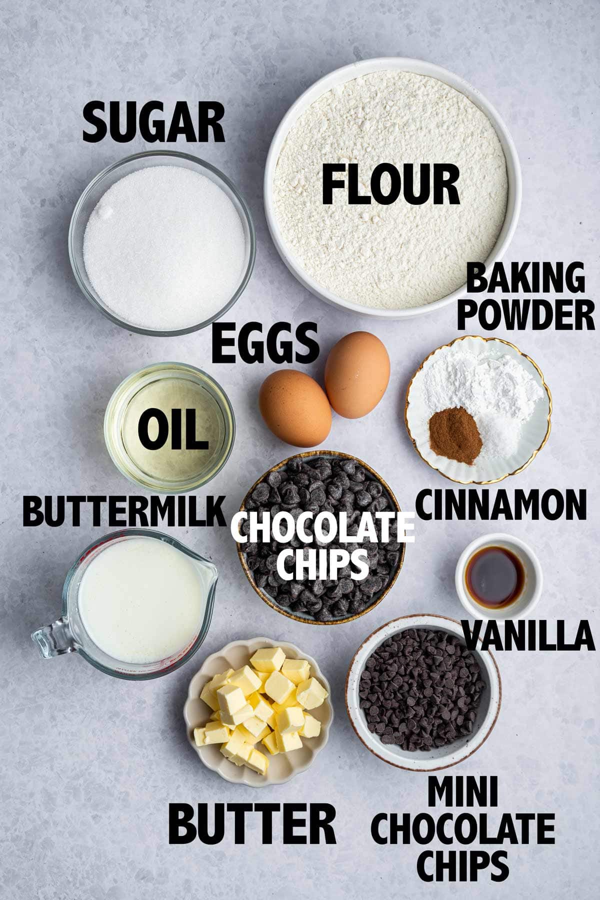 overhead photo showing all the ingredients needed to make chocolate chip muffins.