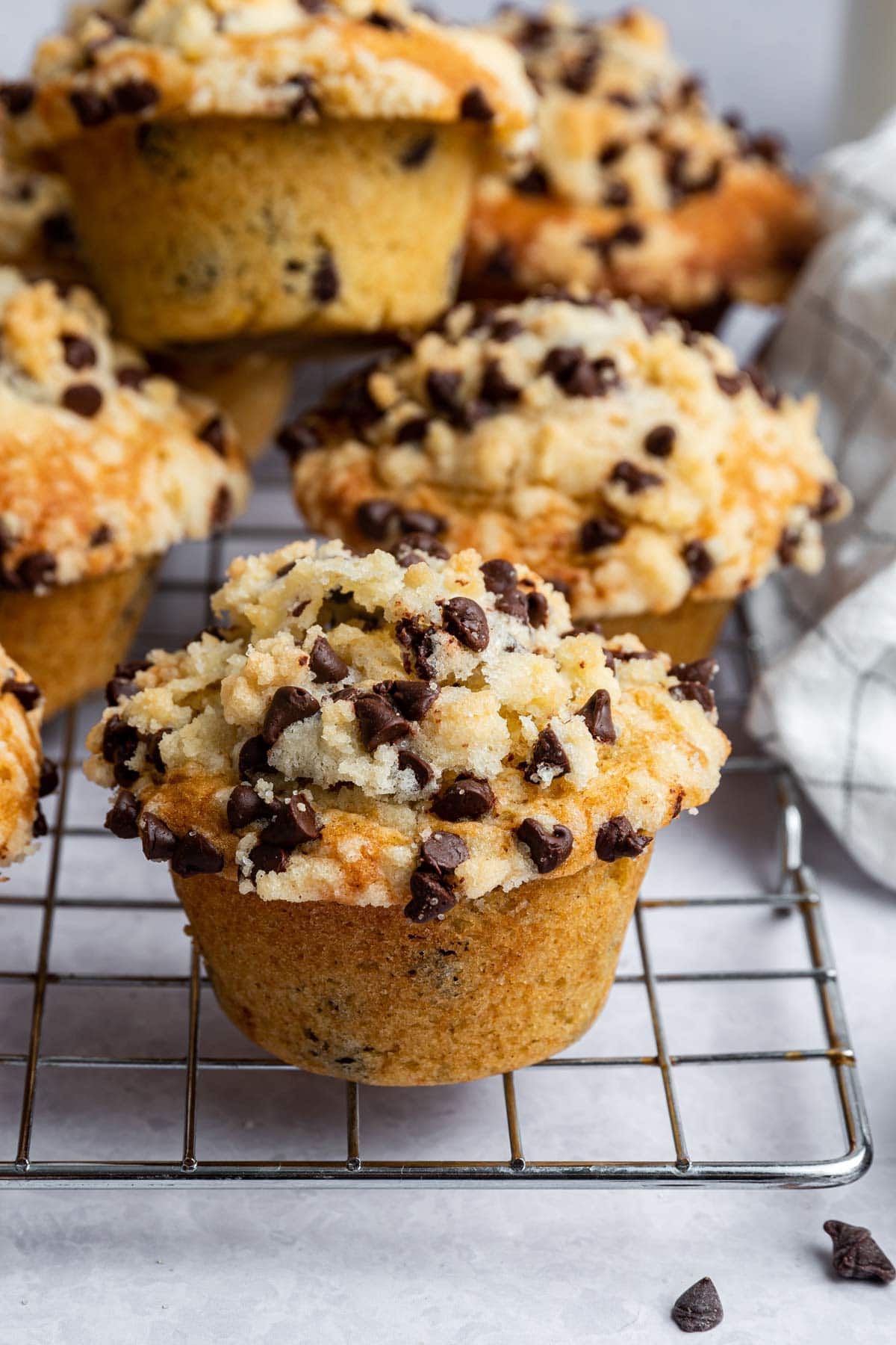 multiple jumbo muffins cooling on a wire cooling rack.