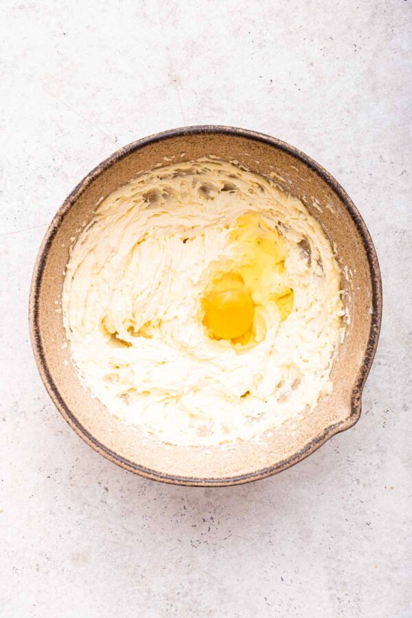 creamed butter and sugar with eggs cracked on top.