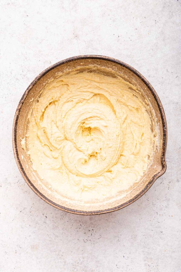 unbaked frangipane mixture in a brown mixing bowl.