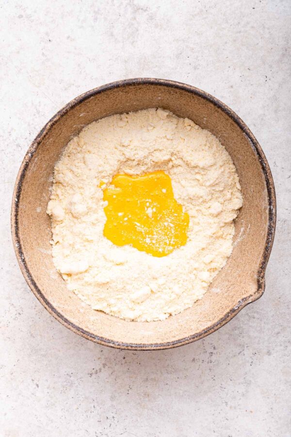 egg yolks on top of a butter and flour mixture.