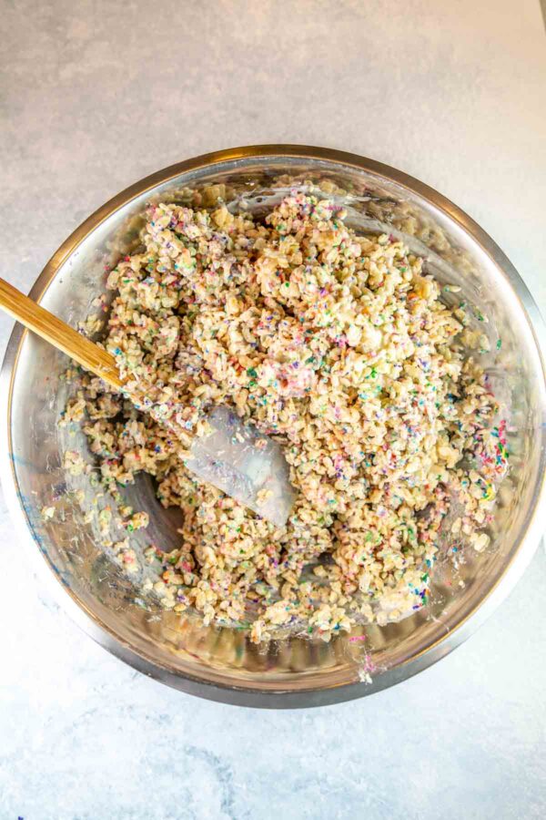 bowl full of rice krispie mixture with sprinkles.
