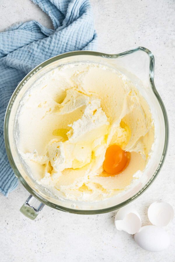 creamed butter and sugar with an egg cracked into the mixture.