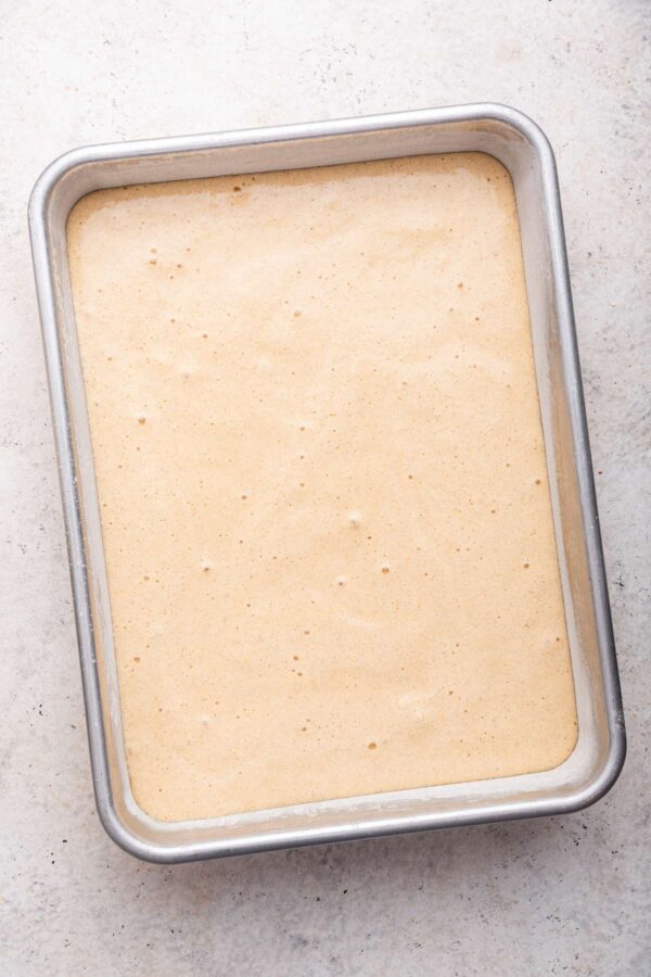 unbaked cake batter in a 9x13-inch metal baking dish.