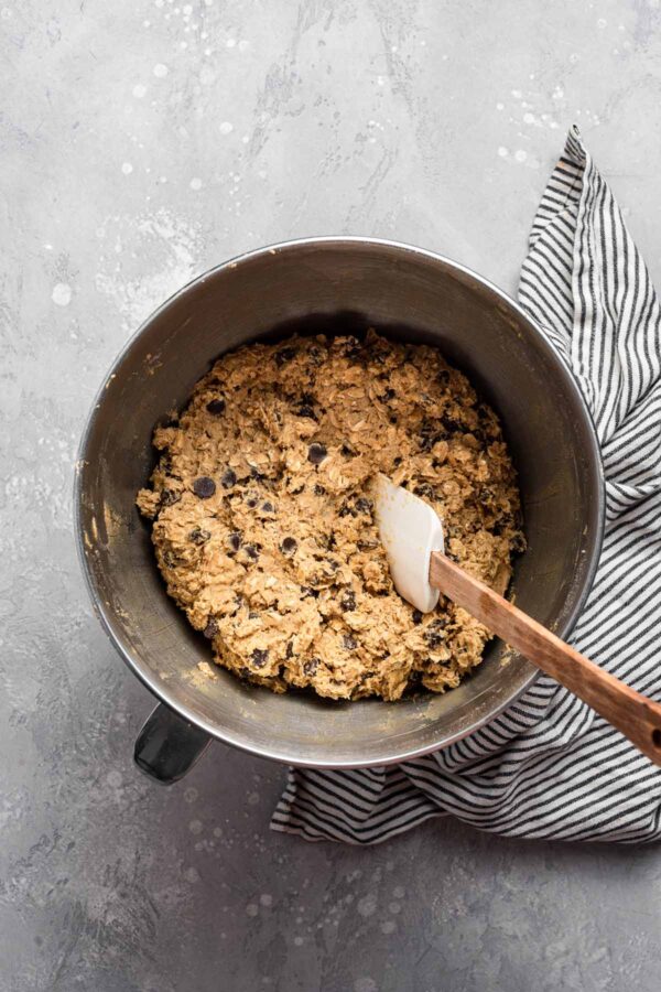 chocolate chip lactation cookie dough in a metal mixing bowl.