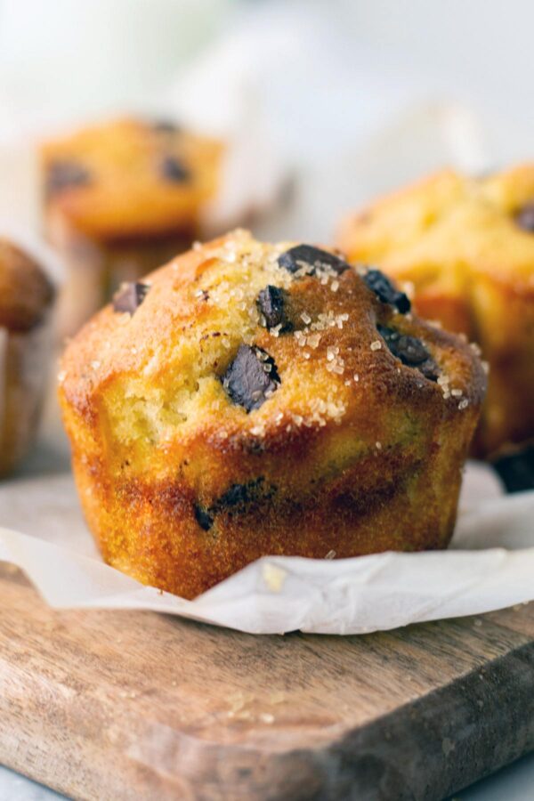 chocolate chunk muffin with a tall domed top.