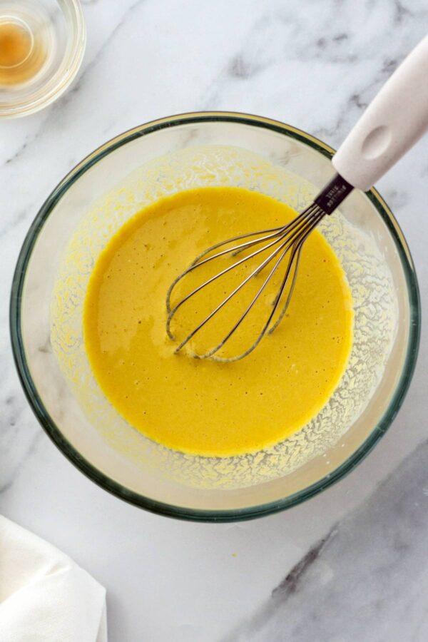 mixing bowl with whisked eggs, milk, and vanilla.