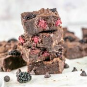 stack of four blackberry brownies filled with chocolate chips.