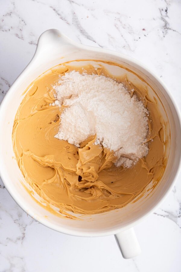 beating sugar into buttercream frosting.