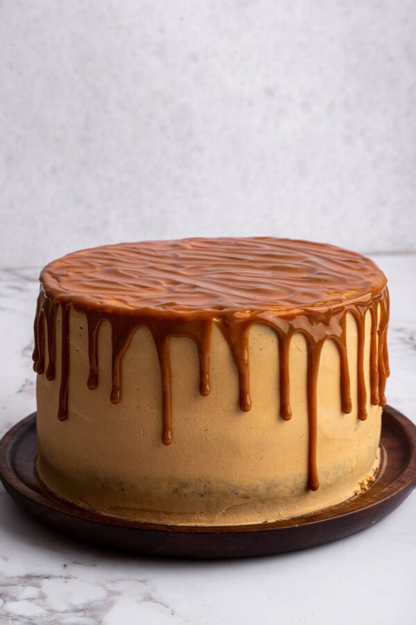 chocolate cake with caramel frosting covered with a layer of homemade salted caramel.