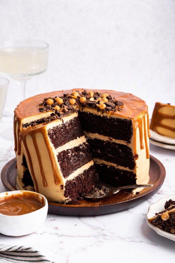 chocolate caramel cake with several slices removed.