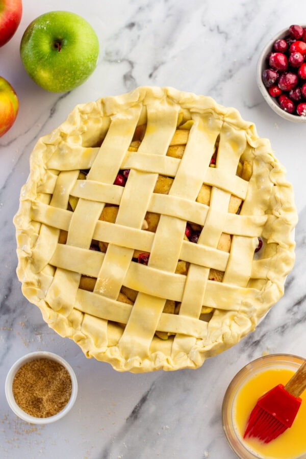 unbaked lattice topped cranberry apple pie.