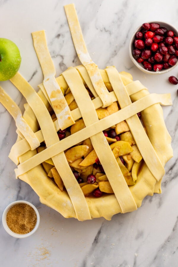 halfway through making a lattice crust on a pie.