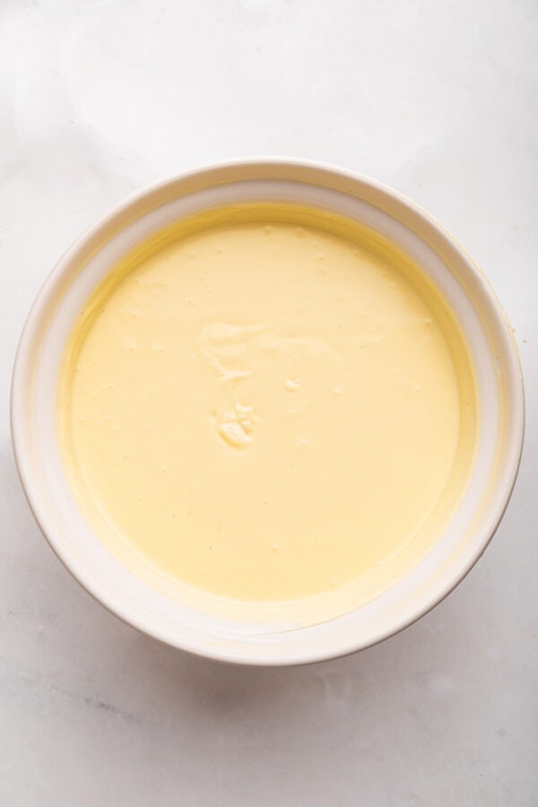 smooth creamy cheesecake batter in a mixing bowl.