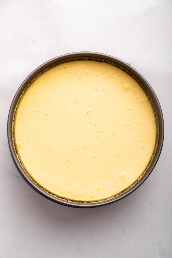 perfectly baked cheesecake with a smooth golden top.