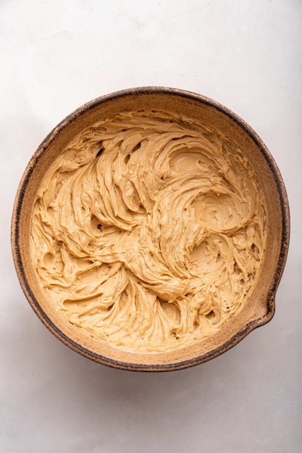 fluffy homemade peanut butter cheesecake dip in a decorative bowl.