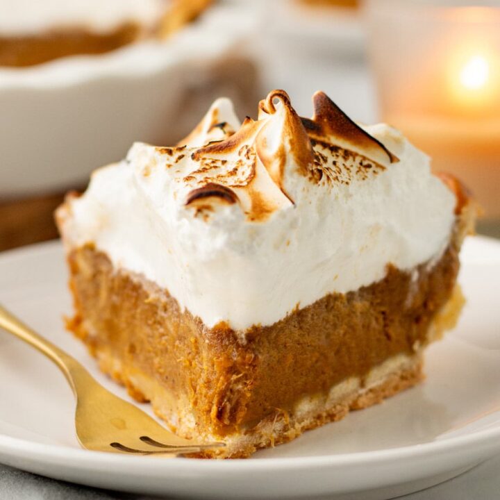 slice of sweet potato pie topped with a thick layer of toasted meringue.