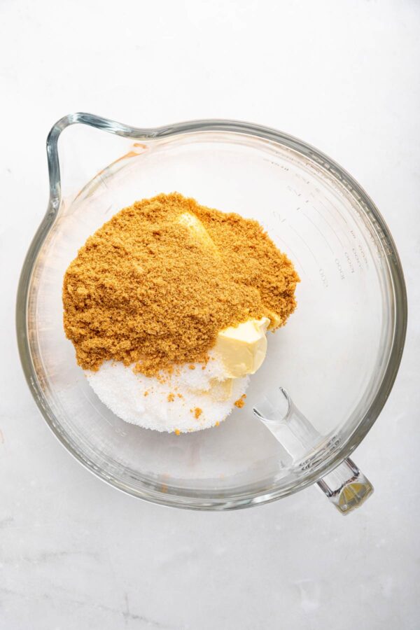 butter, brown sugar, and granulated sugar in a glass mixing bowl.