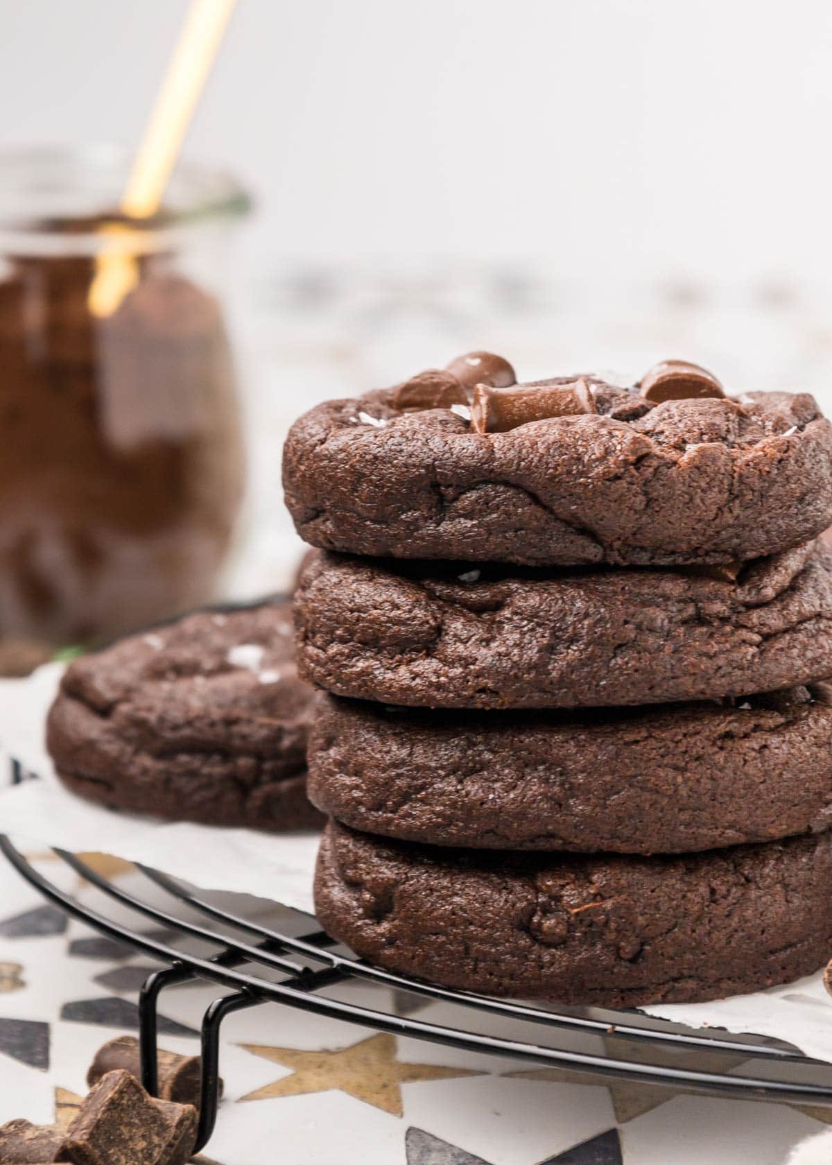 stack of four thick and chewy chocolate cookies.