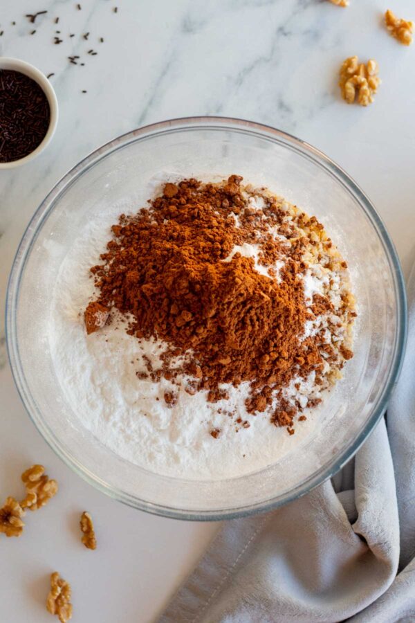 cookie crumbs, powdered sugar, and cocoa powder in a mixing bowl.