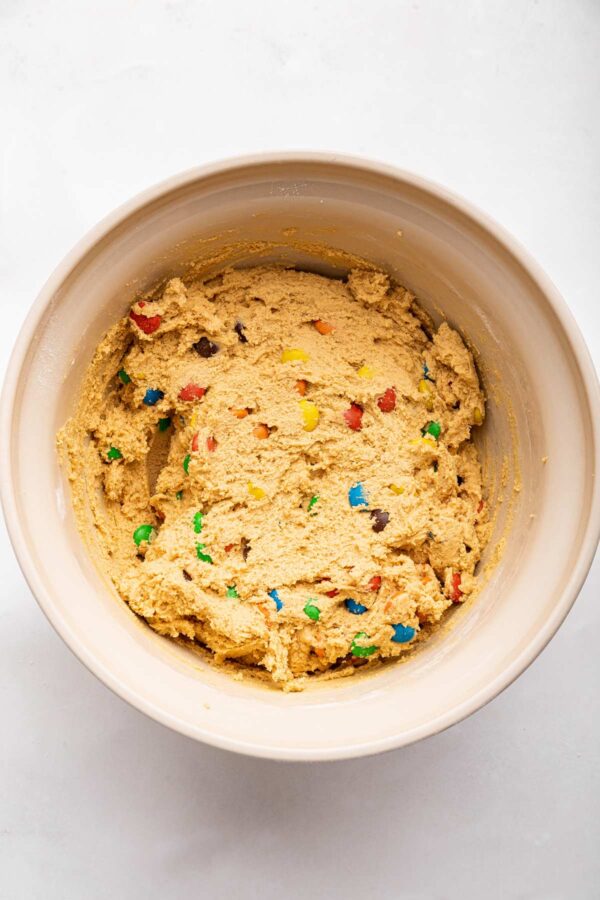 cooking dough to make M&M pudding cookies.