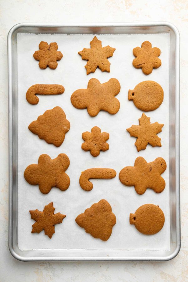 baked gingerbread cookies on a cookie sheet.