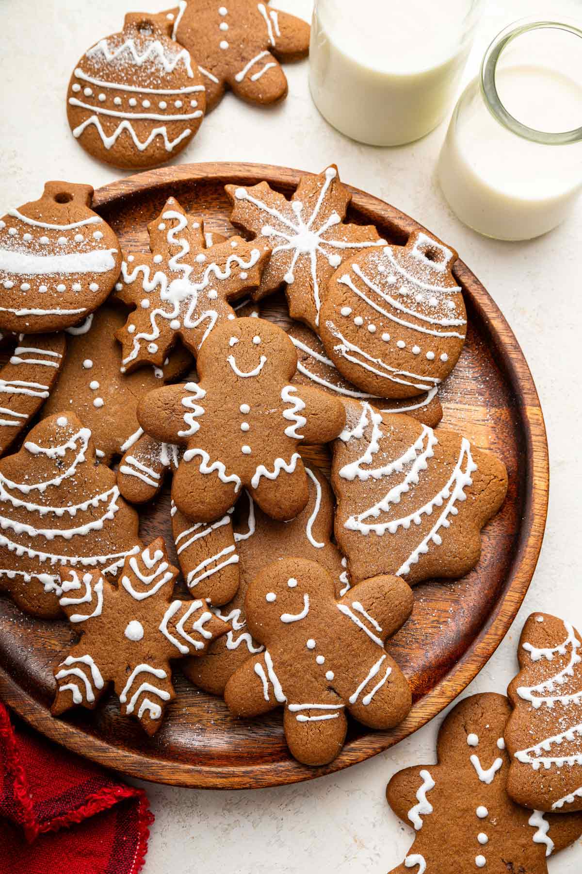 decorated soft gingerbread cookies on a wooden tray.