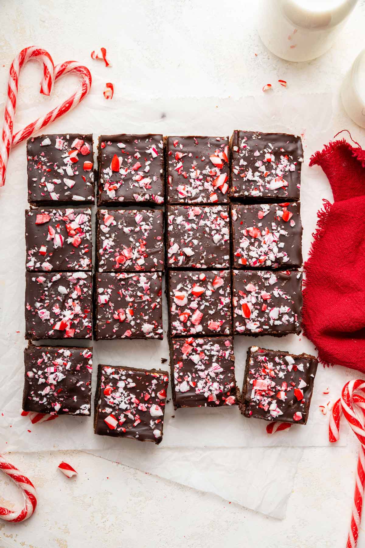 fudgy brownies covered with ganache and crushed candy canes.