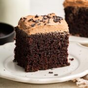 slice of chocolate sheet cake covered in creamy chocolate buttercream.