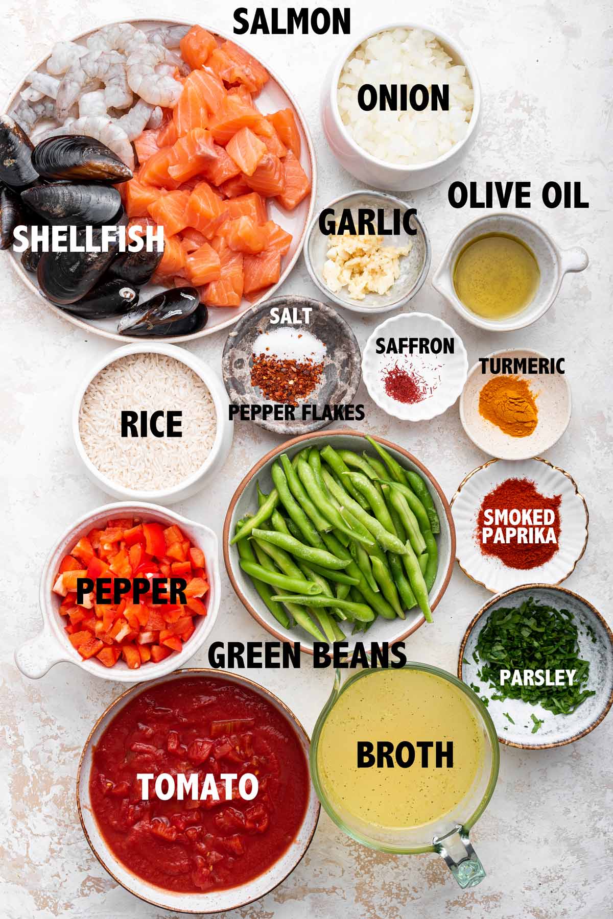 overhead view of ingredients used to make salmon paella.