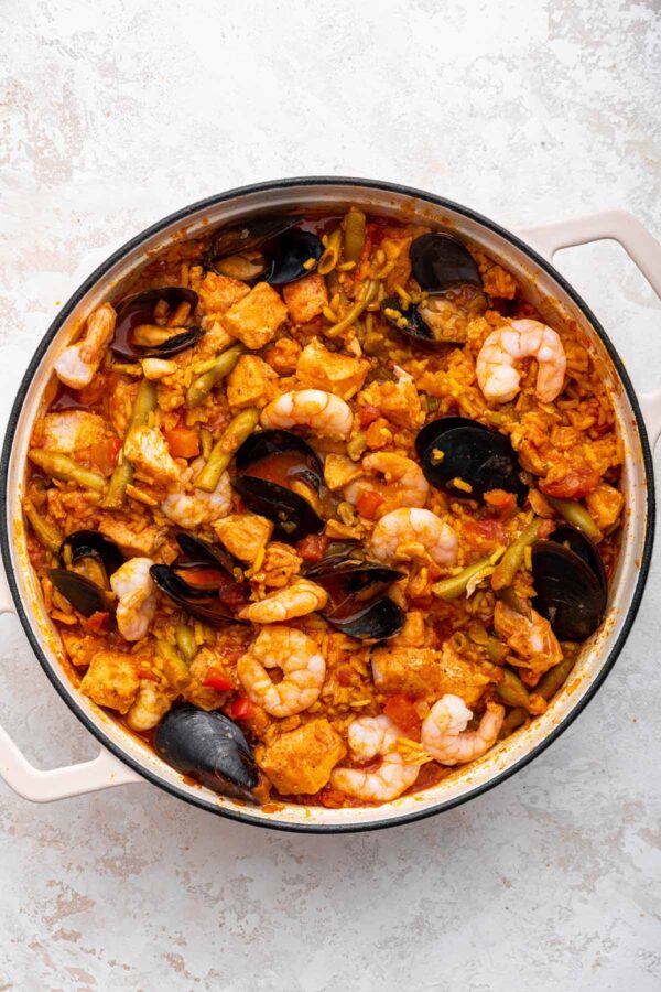 freshly made salmon paella with green beans and crispy rice.
