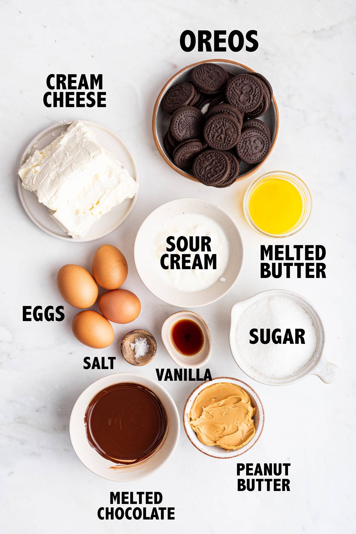 overhead view of ingredients used to make a chocolate peanut butter cheesecake.