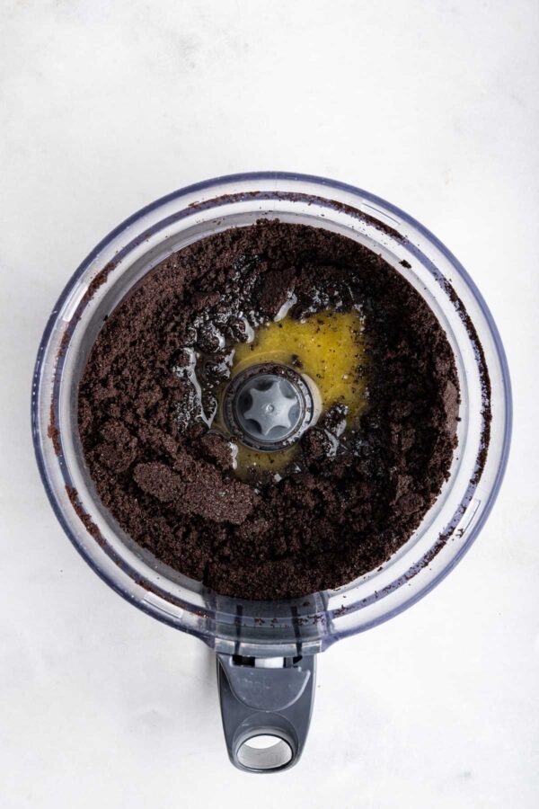 oreo cookie crumbs and melted butter in a food processor.